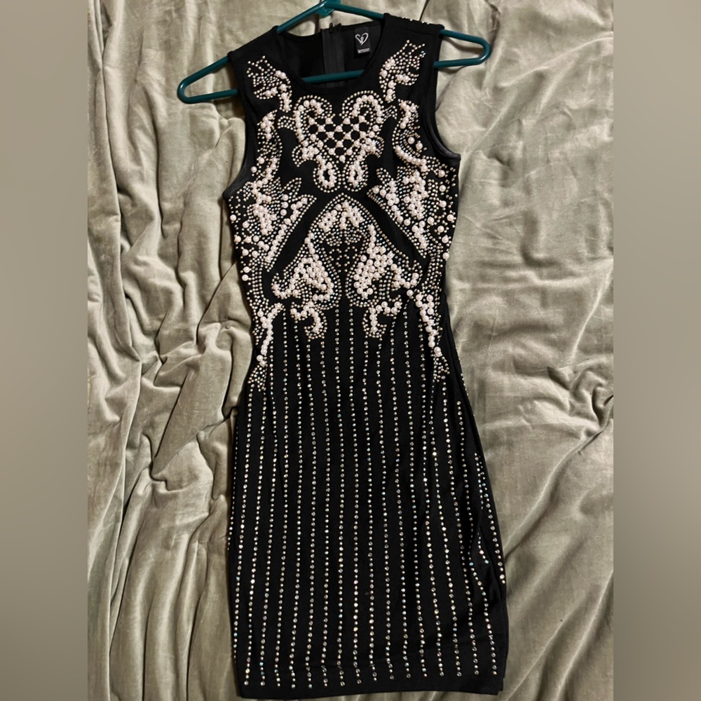 Black mini dress with pearl embellishment